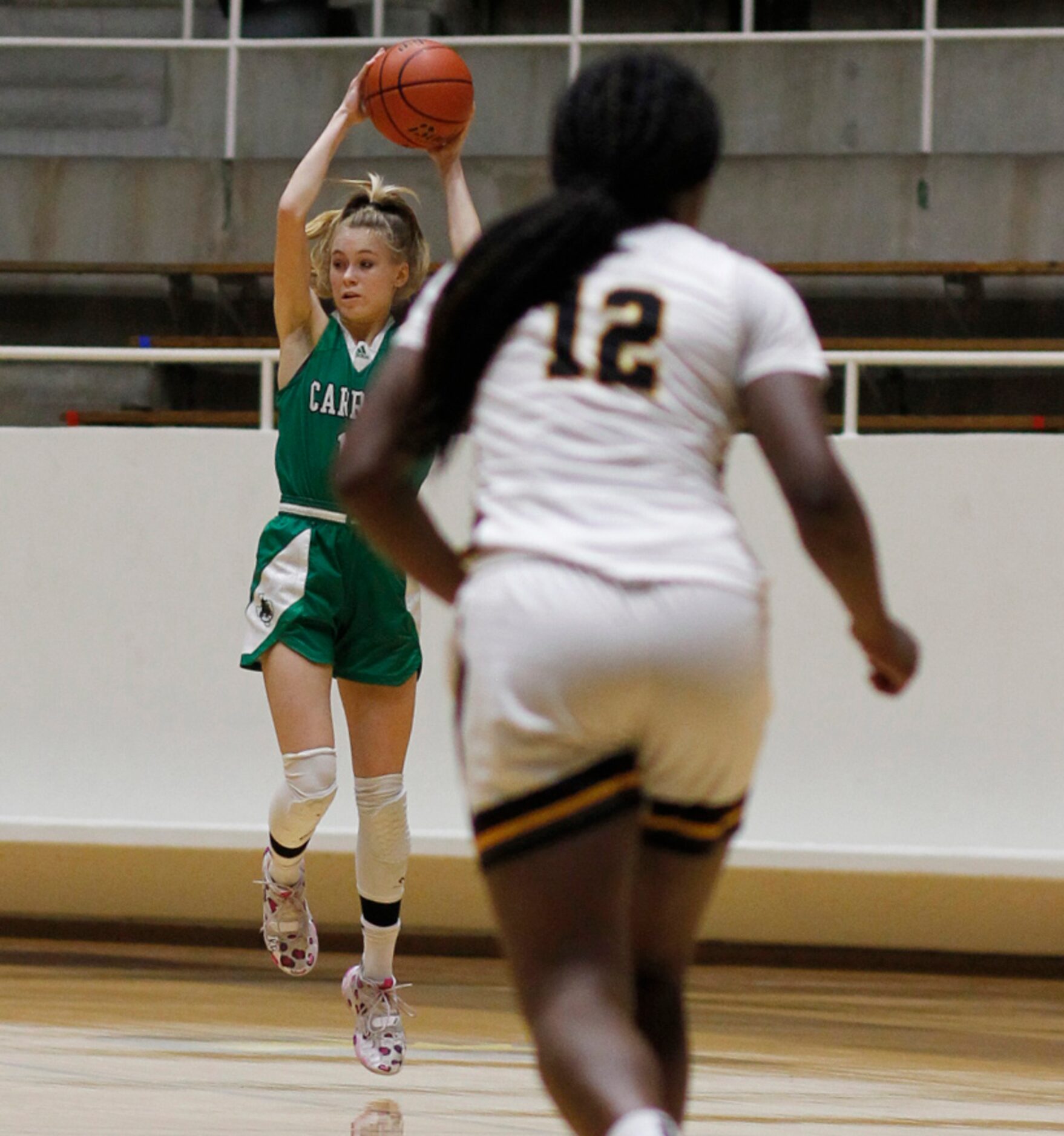 Southlake Carroll guard Kelsey Boyette (10) leaps to pull in a tall pass as Plano East guard...