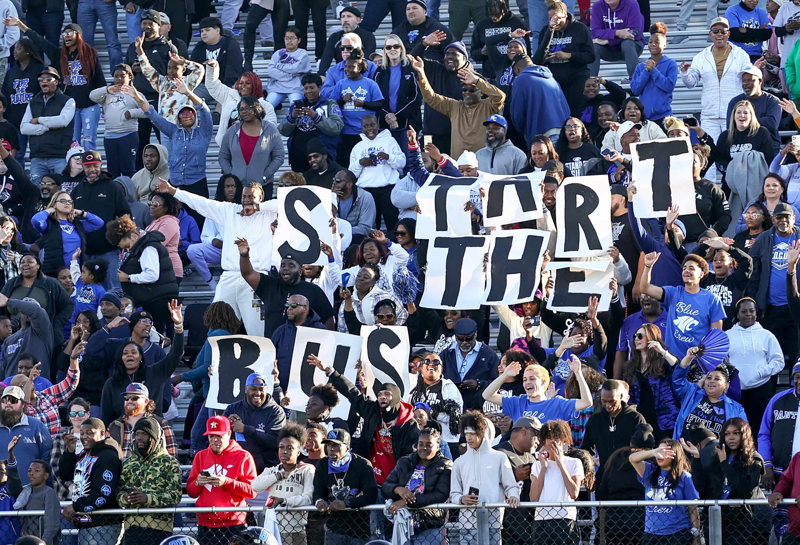 The North Crowley fans hold up "Start the bus" during the game against Allen in the 6A...