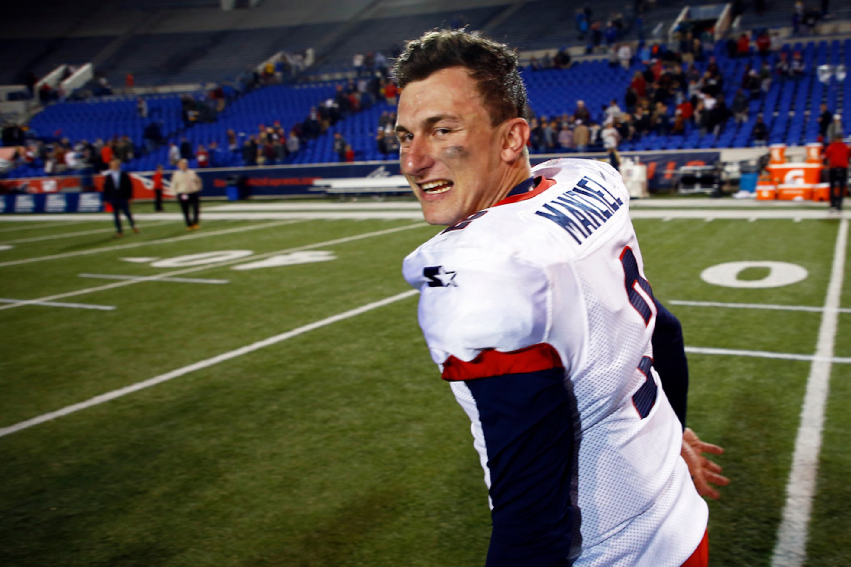 Memphis Express quarterback Johnny Manziel celebrates as he leaves the field after a...