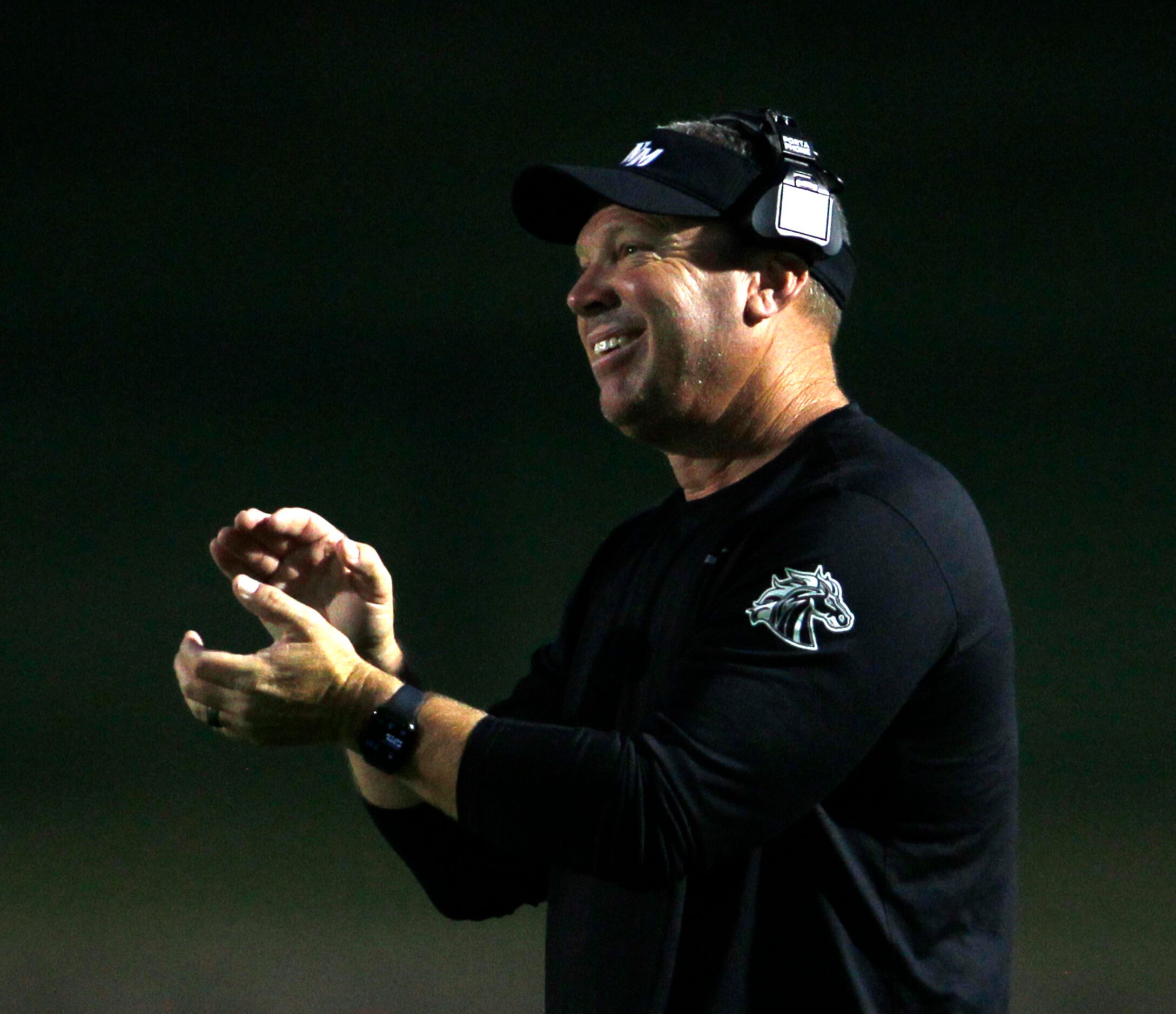 North Mesquite head coach Tim Seder was all smiles after a Stallions score during first half...