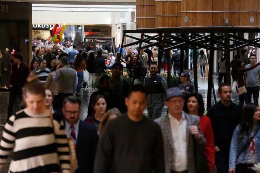 People walking in the NorthPark Center in Dallas on Nov. 23, 2018. (Nathan Hunsinger/The...