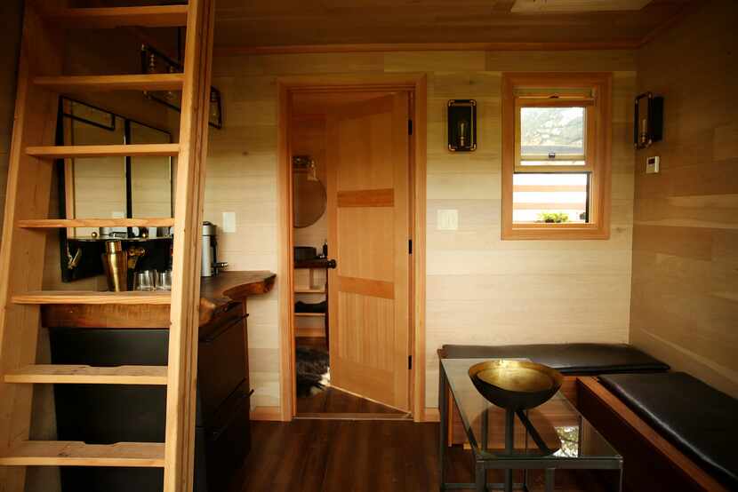 The living space in the tree house features a dry bar, a bathroom and ample seating.