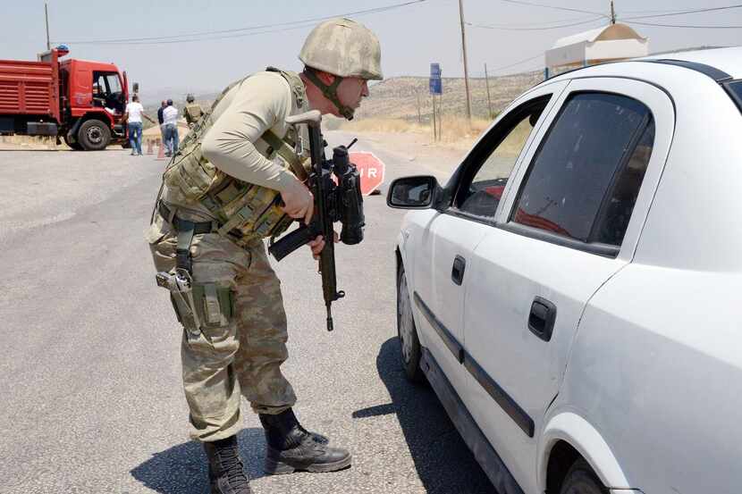 
A Turkish soldier manned a checkpoint in Diyarbakir on Sunday after a car bomb attack...
