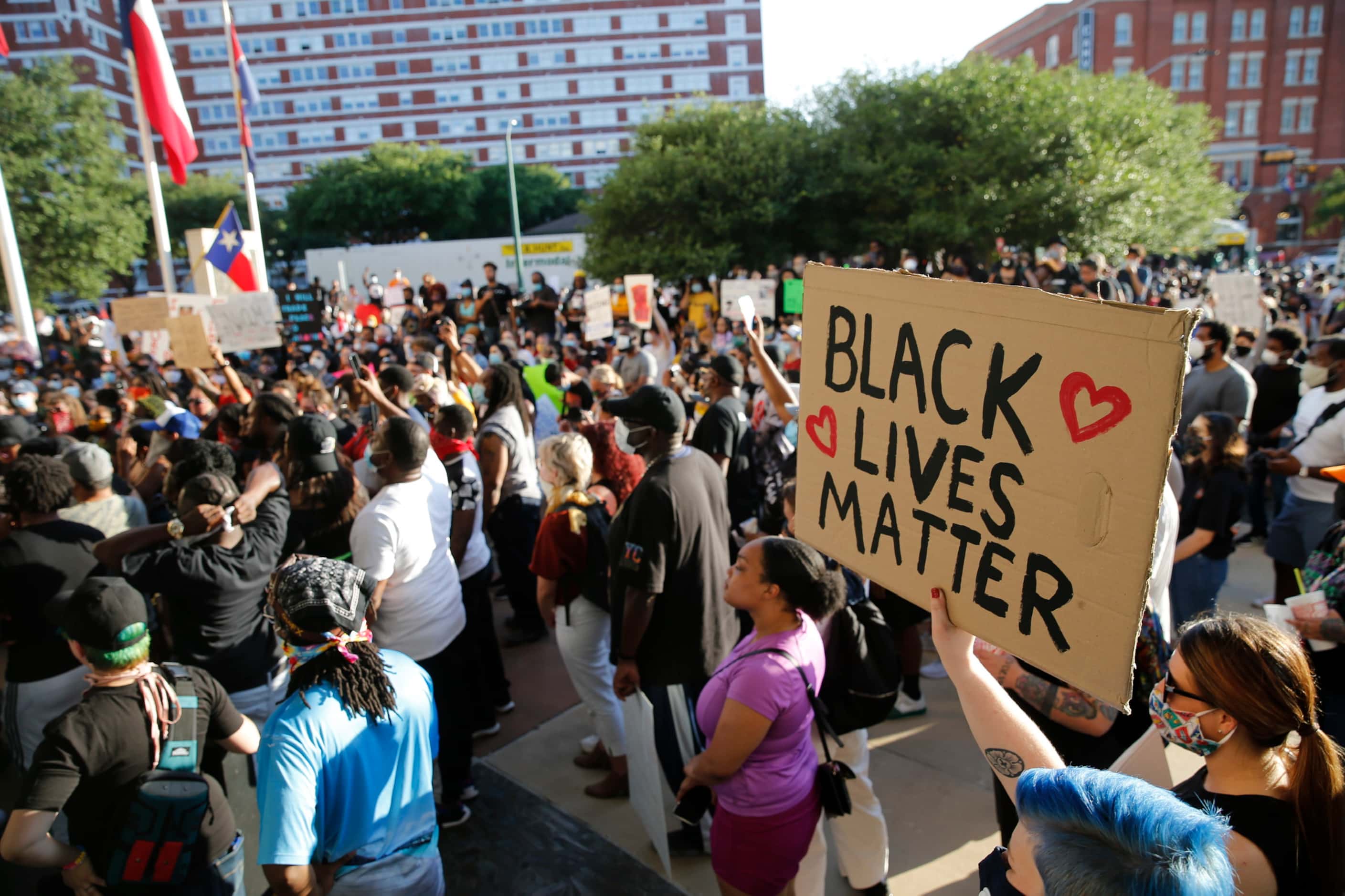 Protesters rally Friday during a demonstration against police brutality near downtown...