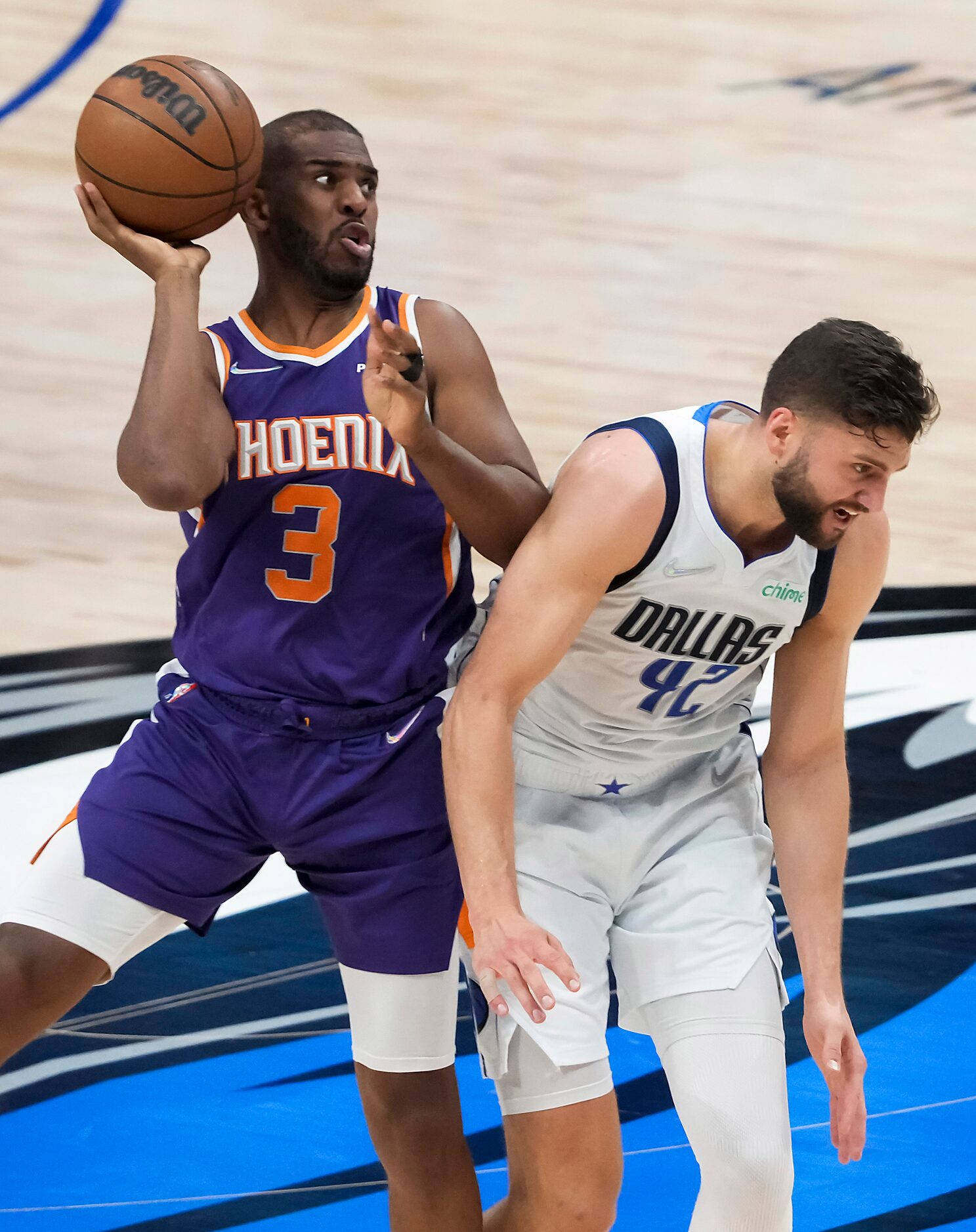 Phoenix Suns guard Chris Paul (3) is fouled by Dallas Mavericks forward Maxi Kleber (42)...