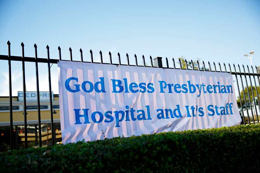 A sign near Texas Health Presbyterian Hospital proclaims support.