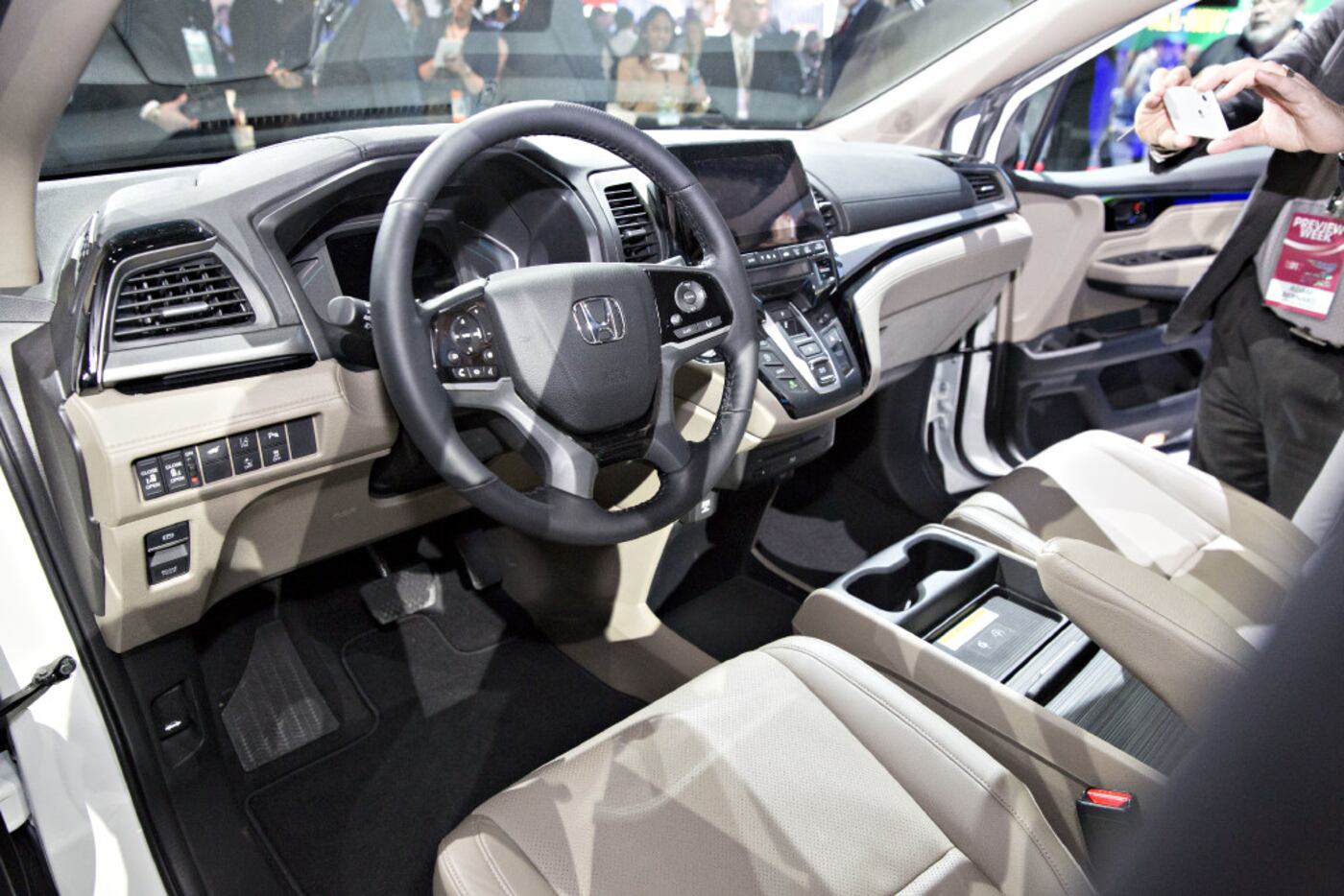 An attendee uses a mobile device to photograph the interior of the 2018 Honda Motor Co....