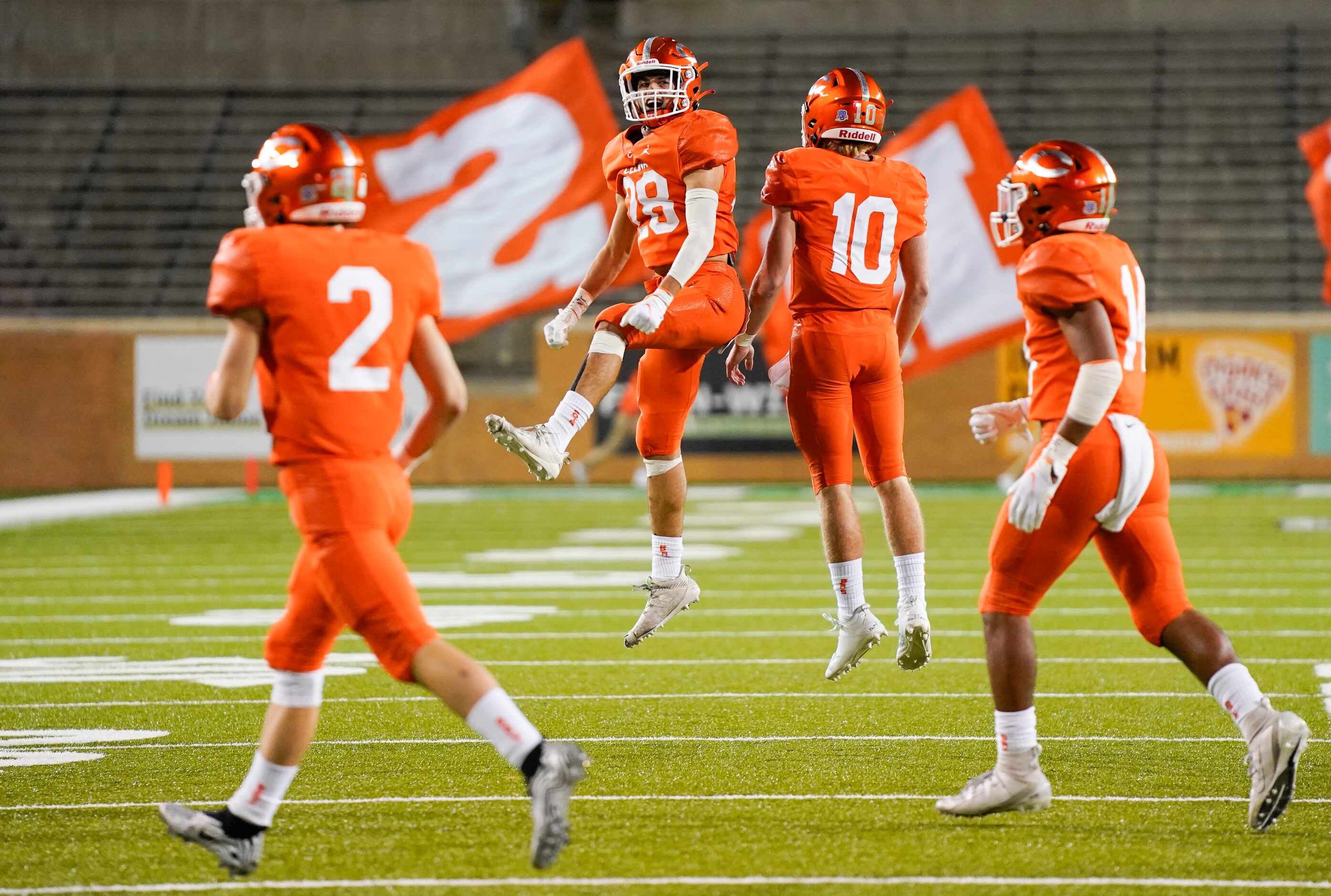 Celina quarterback Noah Bentley (10) celebrates with Ty Marghiljohni (28) after a Bobcats...