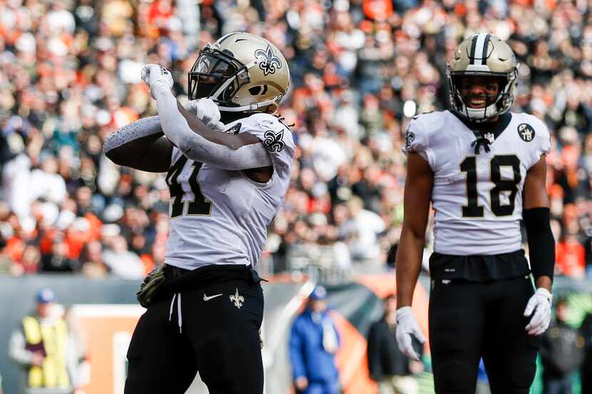 New Orleans Saints running back Alvin Kamara (41) reacts after scoring a touchdown in the...