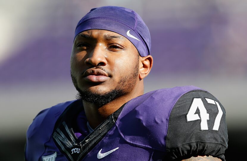 Linebacker Paul Dawson #47 of the TCU Horned Frogs warms up before the Big 12 college...