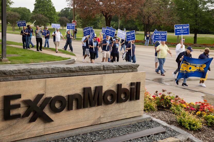 ExxonMobil workers and union activists protest outside of the ExxonMobil headquarters during...