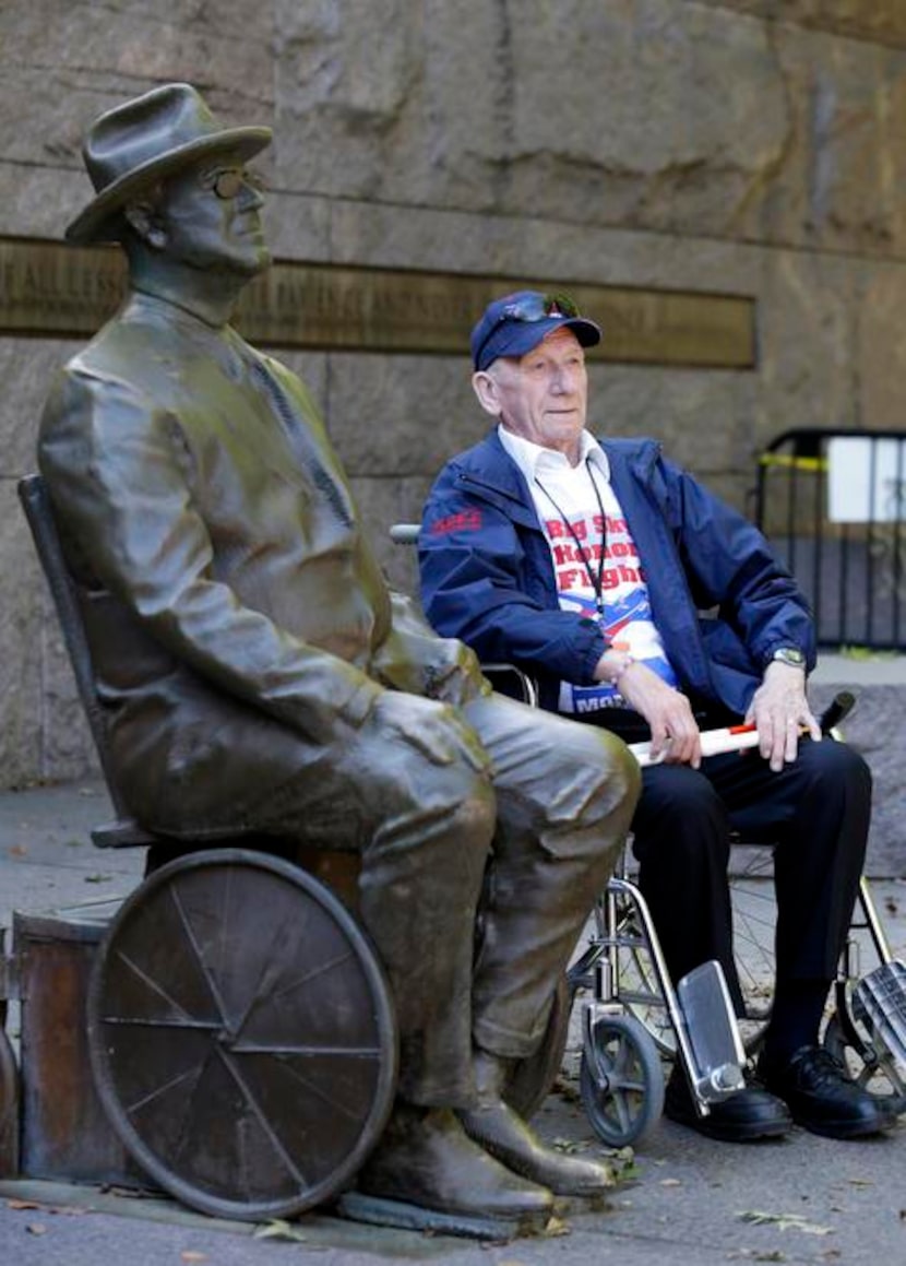 
In this Oct. 14, 2013 file photo, Svend Wind, of Anaconda, Mont., a WWII veteran, poses for...