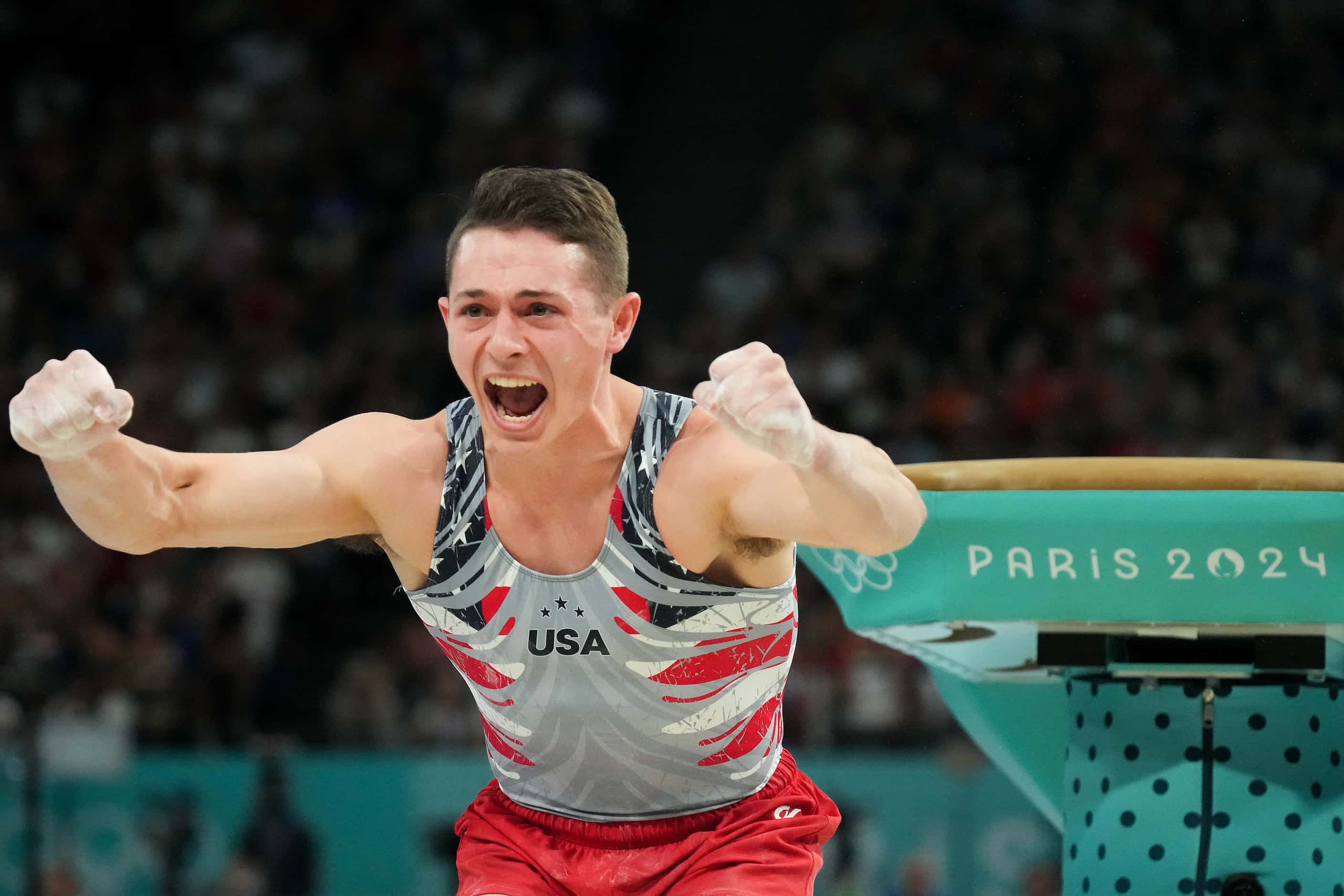 Paul Juda of the United States reacts as he competes on the vault during the men’s...