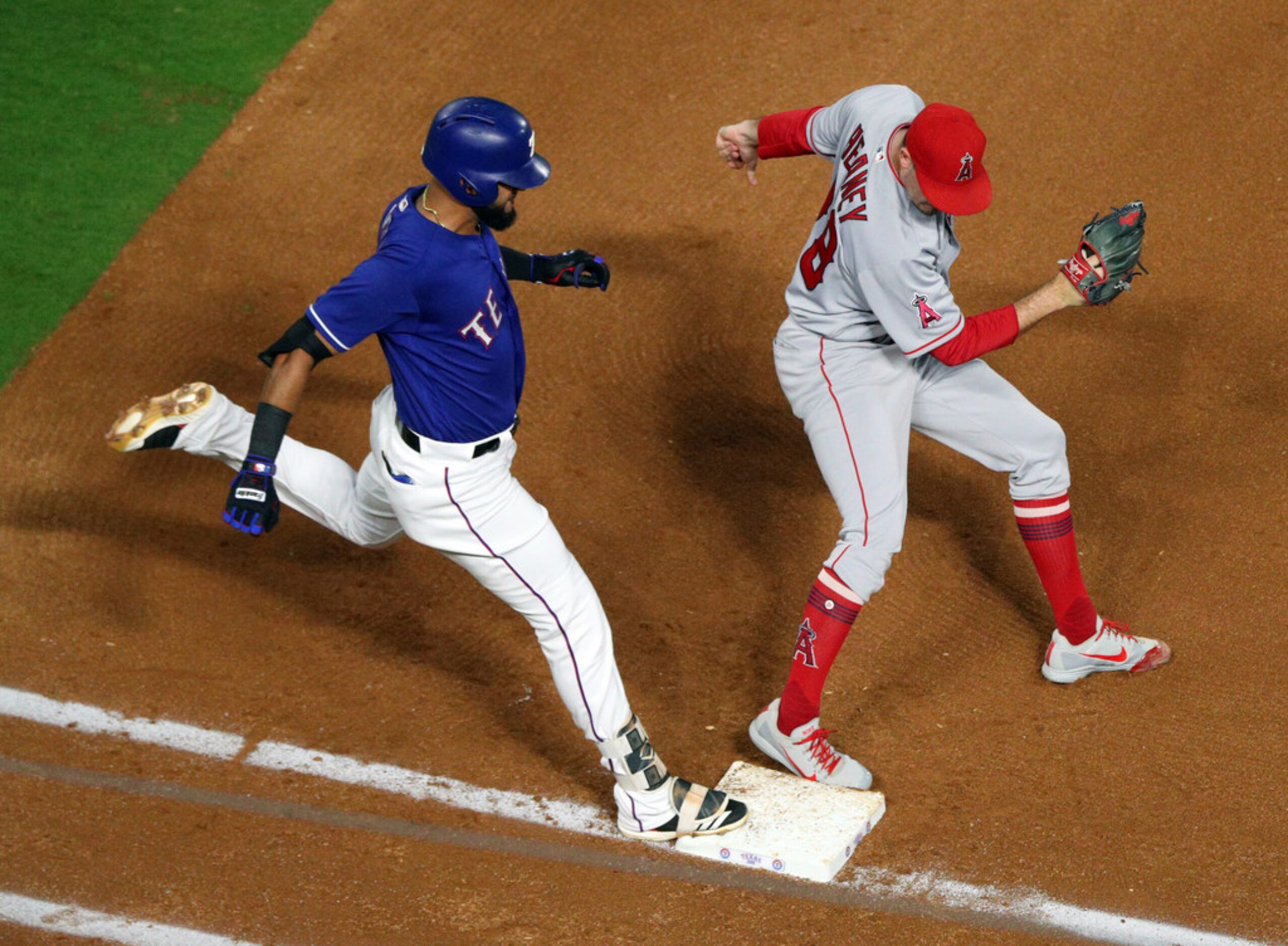 Los Angeles Angels starting pitcher Andrew Heaney (28) beats Texas Rangers' Nomar Mazara...