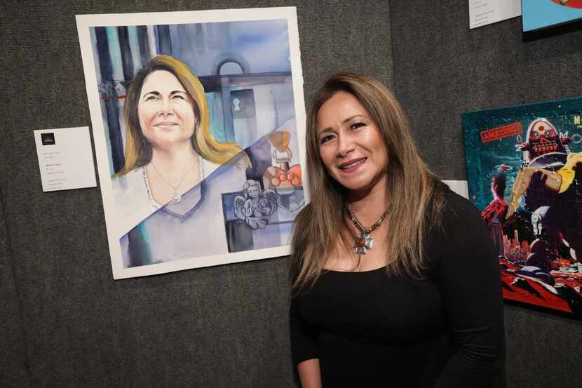 A former client of the Human Rights Initiative of North Texas poses with a portrait inspired...