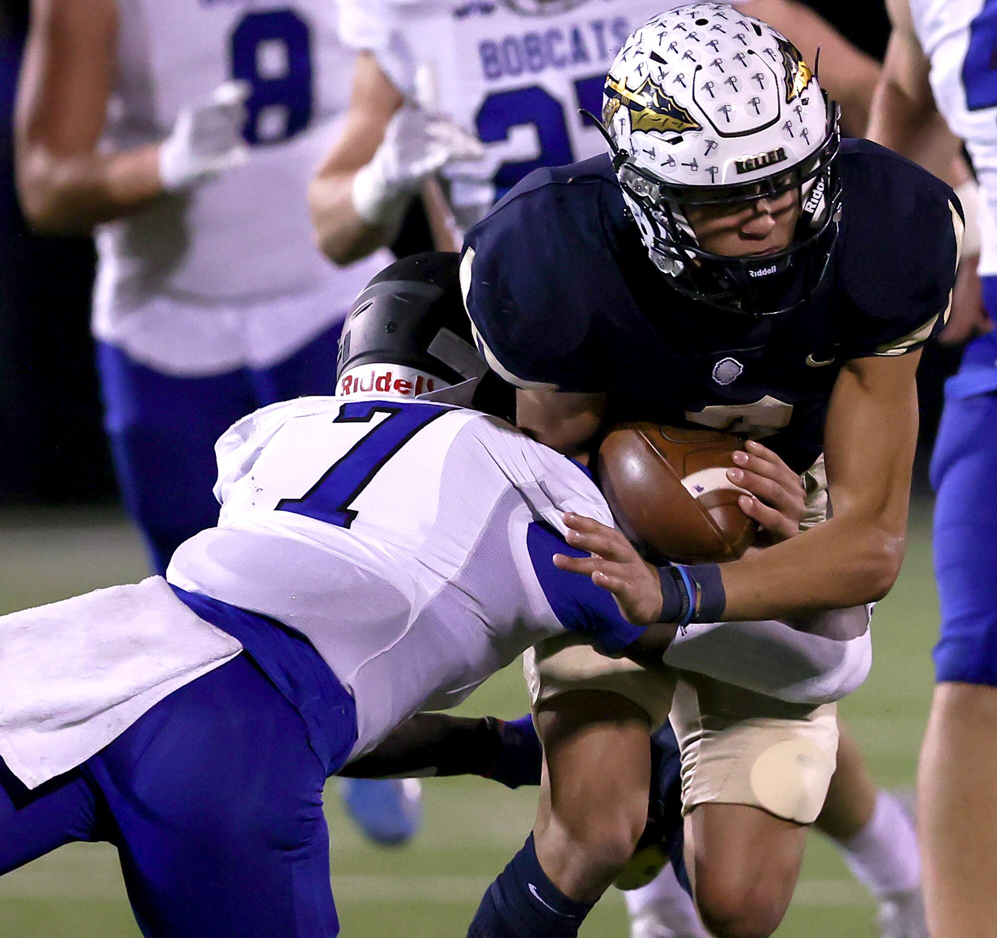 Keller quarterback Tre Guerra (R) is tackled for no gain by Byron Nelson cornerback David...