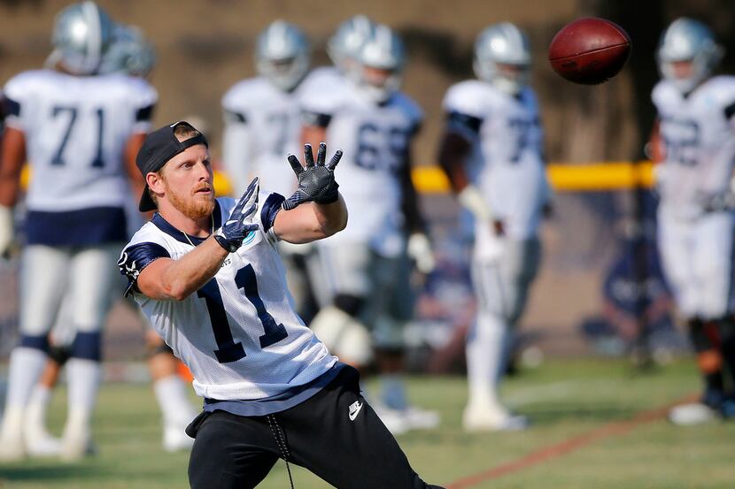 Dallas Cowboys wide receiver Cole Beasley catches a pass during the afternoon practice at...
