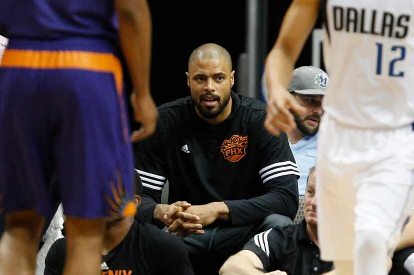 Phoenix Suns center Tyson Chandler (4) watches the game from the seats during the second...