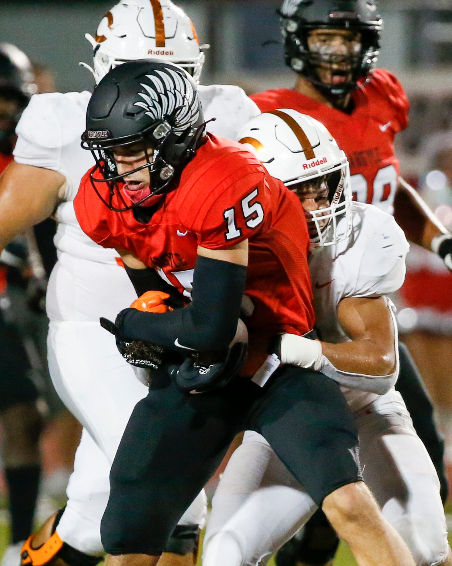 Argyle defensive back Devon Owens (15) is tackled by Celina running back Gabe Gayton (11)...