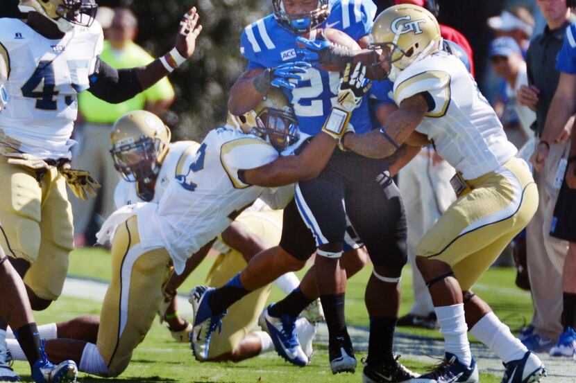 Duke running back Jela Duncan (25) fights for yardage in the first half against the Georgia...