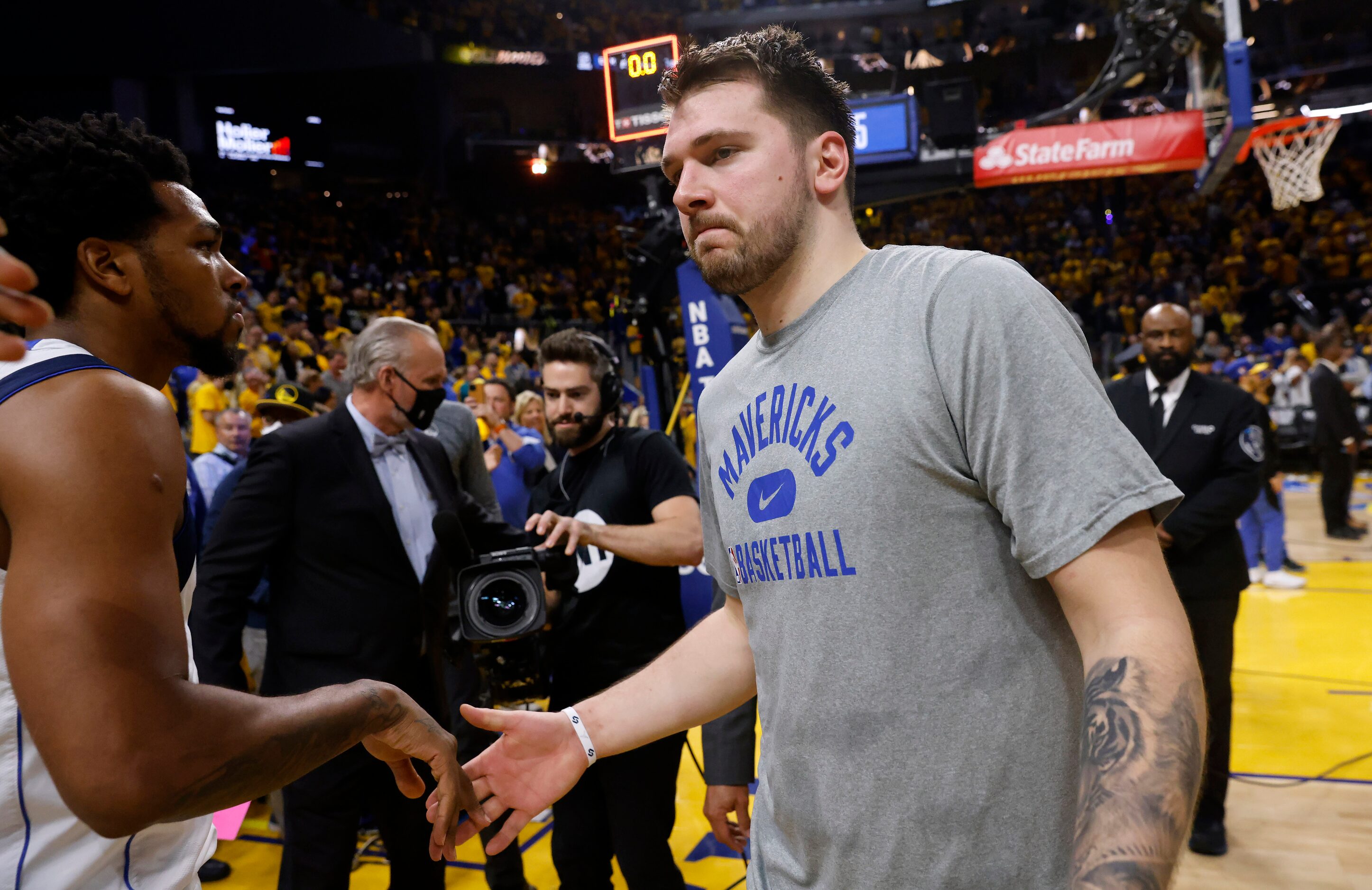 Dallas Mavericks guard Luka Doncic (77) walks off the court following their series loss to...