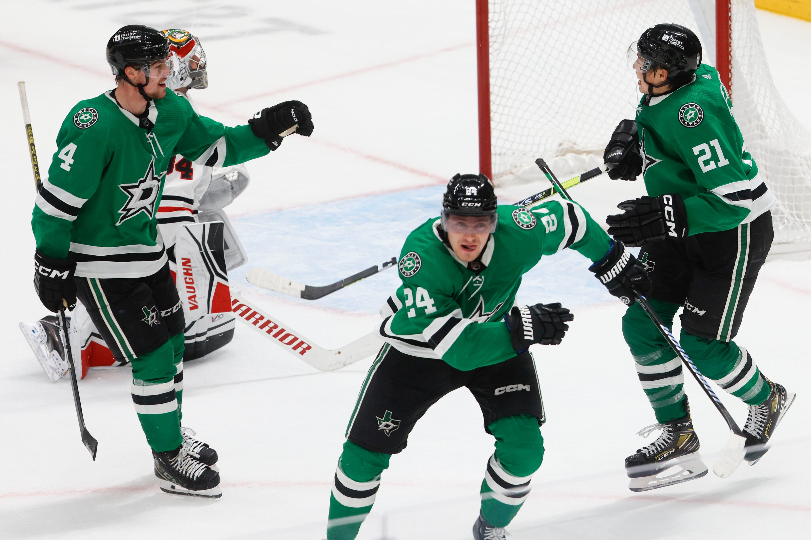 Dallas Stars center Roope Hintz (24) celebrates with Miro Heiskanen (4) and left wing Jason...