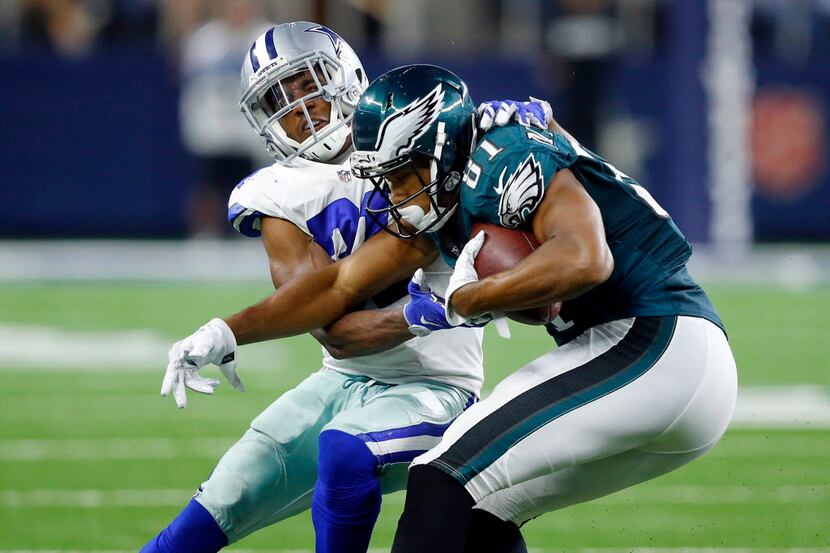 Dallas Cowboys free safety Byron Jones (31) tackles Philadelphia Eagles wide receiver Jordan...