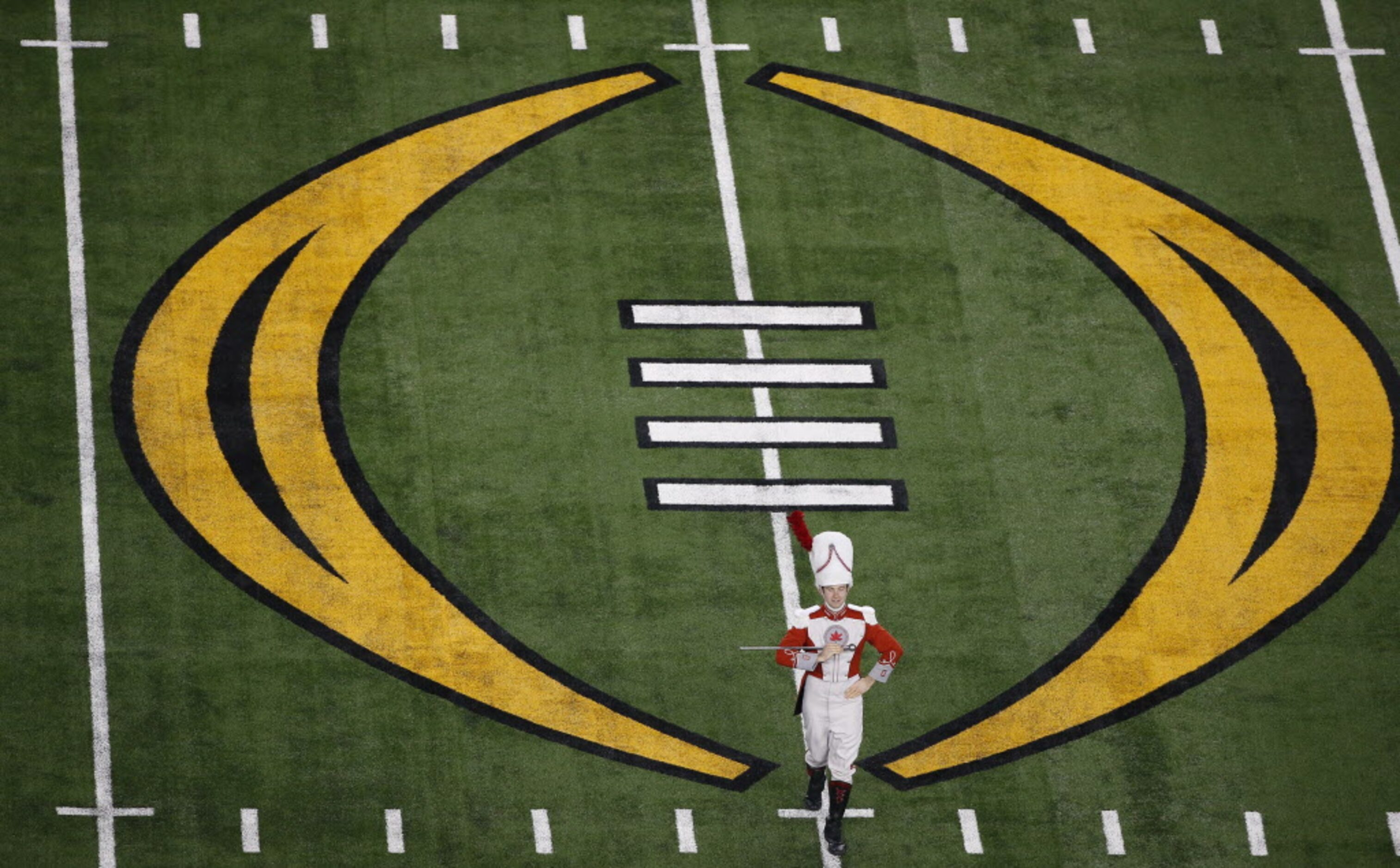 An Ohio State Buckeyes marching band drum performs during the pre game show before the...