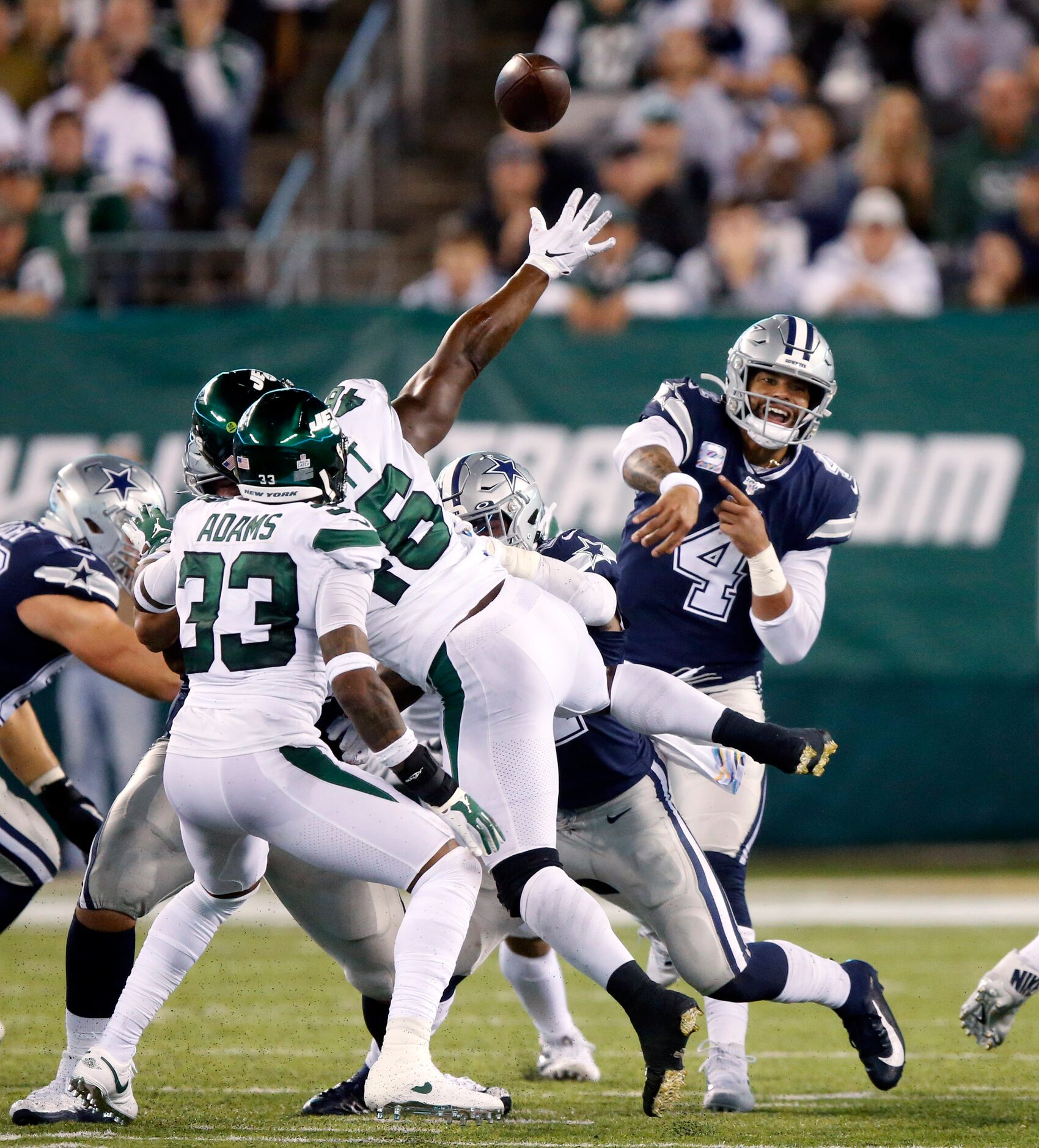 Dallas Cowboys quarterback Dak Prescott (4) throws a fourth quarter pass against the New...