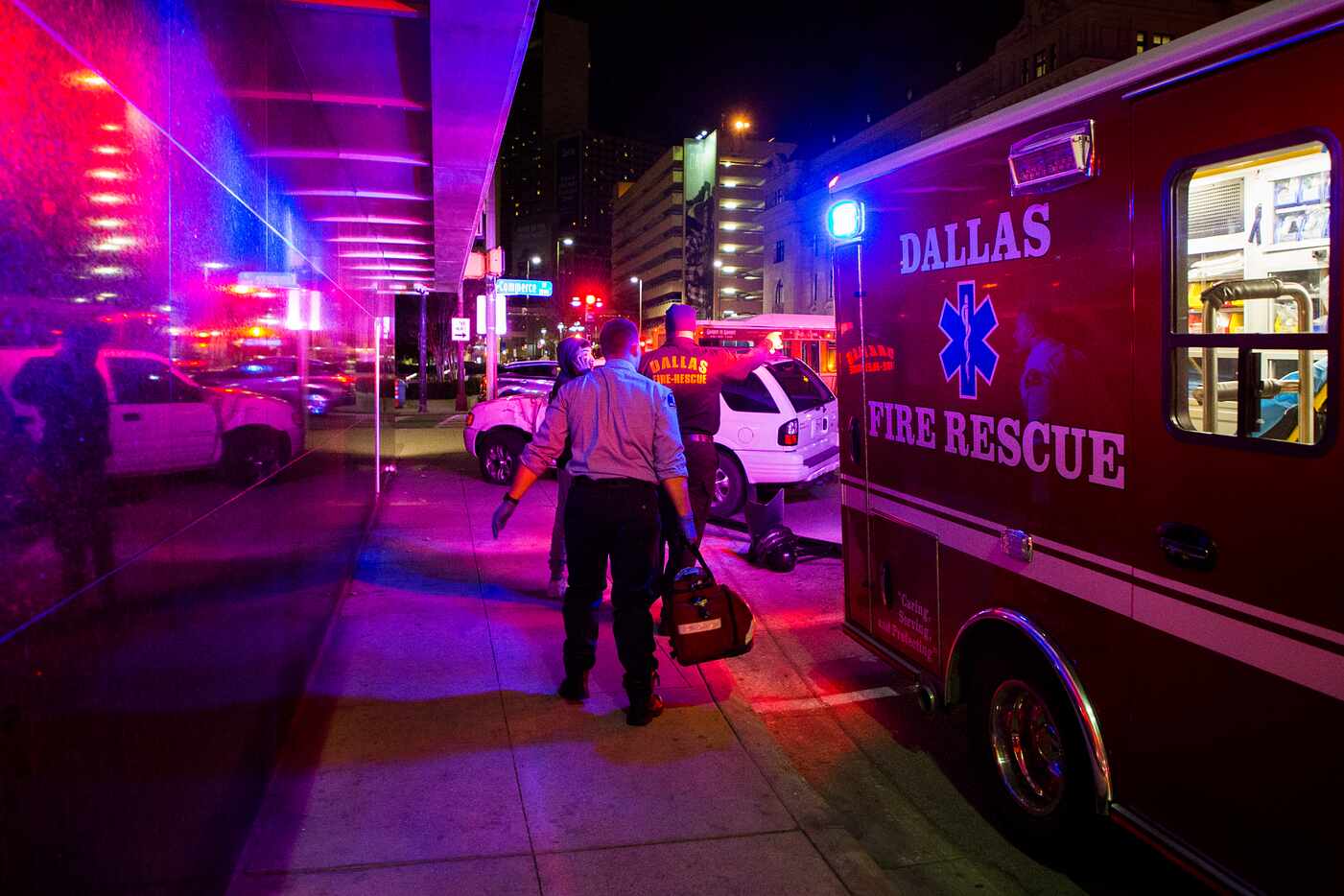 Dallas Fire Rescue crews work the scene of an auto accident at corner of Harwood and...