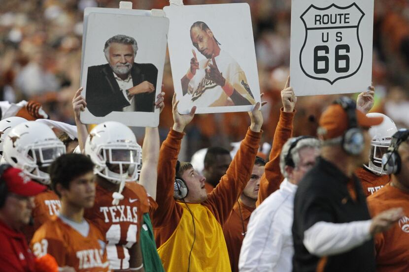 The Texas Longhorns sideline signals the team as they played  the West Virginia Mountaineers...