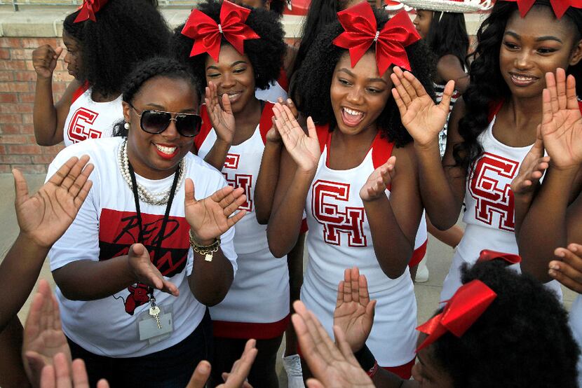 Cedar Hill varsity cheerleader coach Gerrica Davis (left) preps her cheerleaders before...