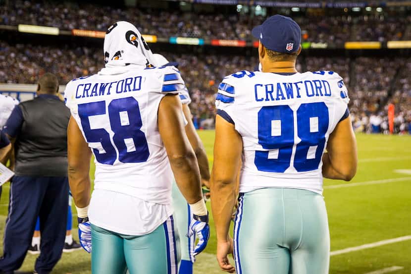 Dallas Cowboys defensive end Jack Crawford (58) stands on the sidelines with defensive...