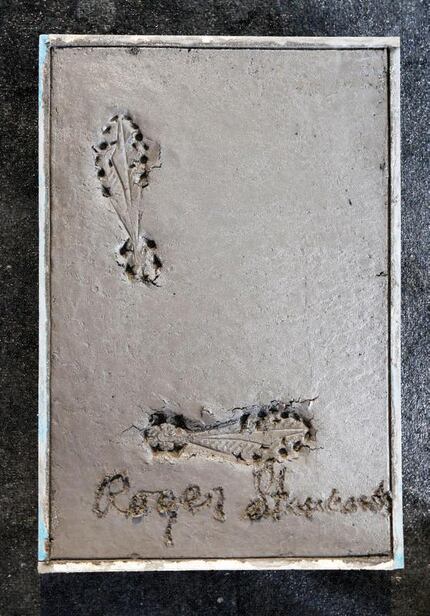 Former Dallas Cowboys Roger Staubach foot imprint and signature in cement during a press...