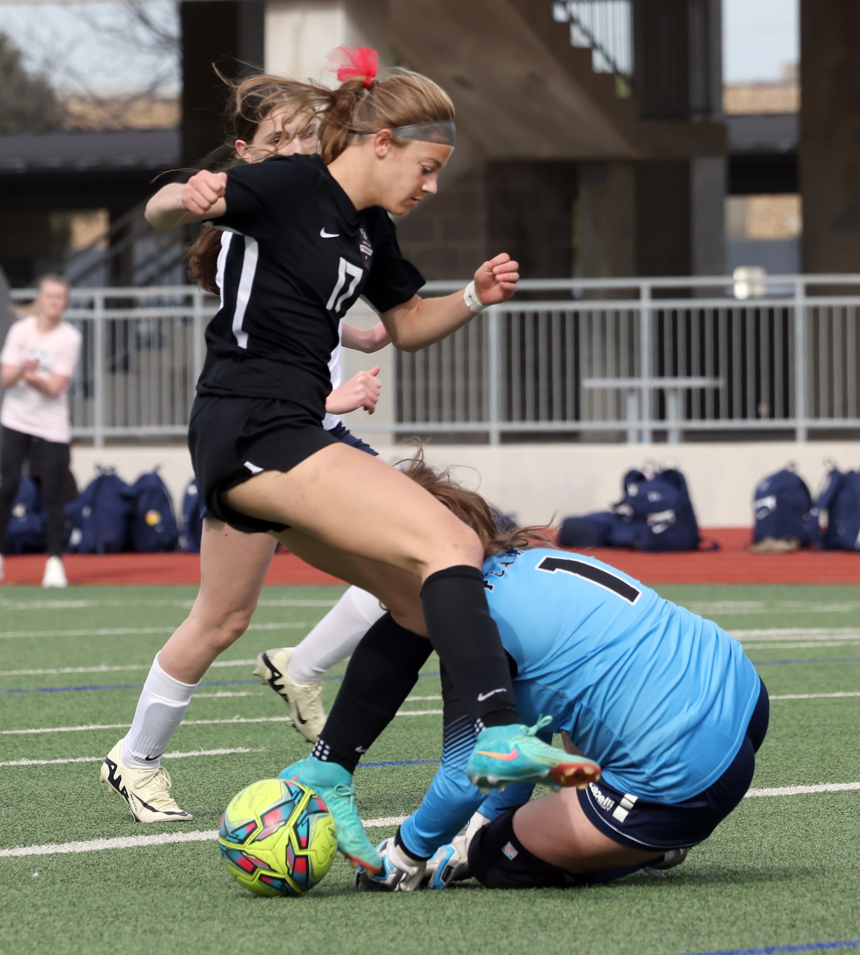 Flower Mound Marcus forward Madi Patterson (17) is stopped by Richardson JJ Pearce...