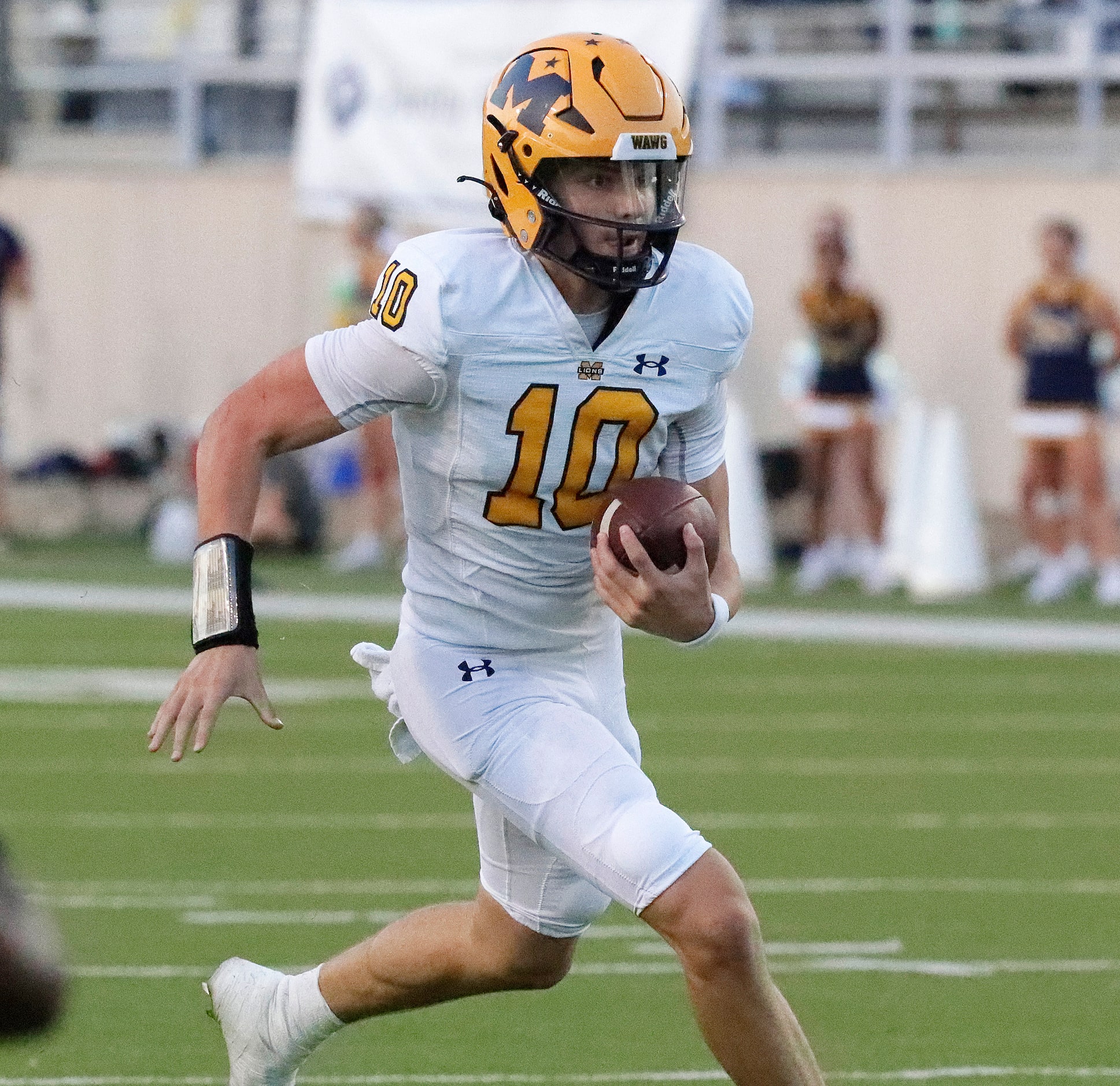 McKinney High School quarterback Jeremiah Daoud (10) carries the football for a touchdown...