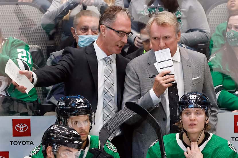 Dallas Stars assistant coach John Stevens (left) confers with head coach Rick Bowness during...