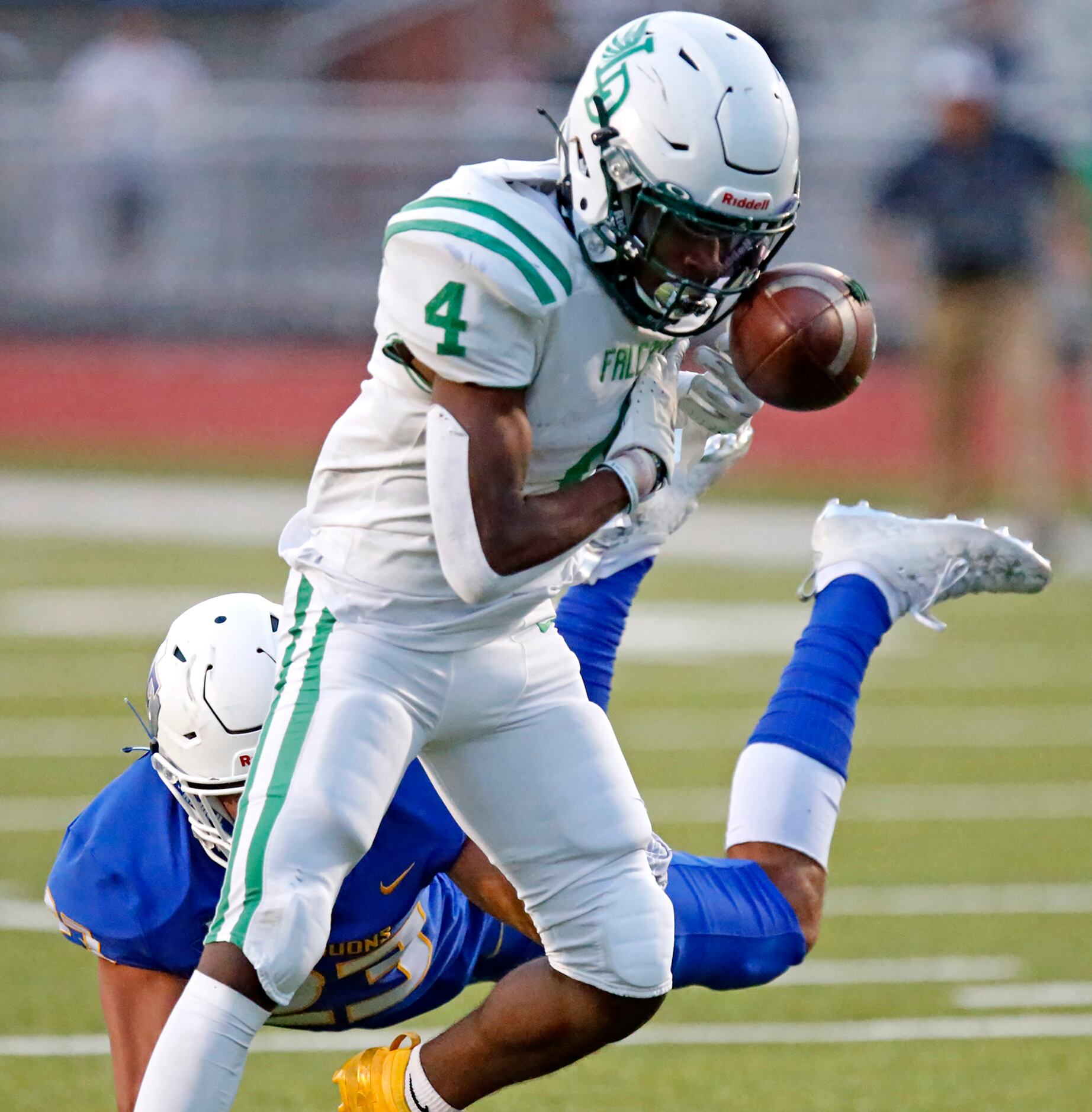 Lake Dallas High School wide receiver Javaan Evans (4) is unable to hang onto the ball ad...