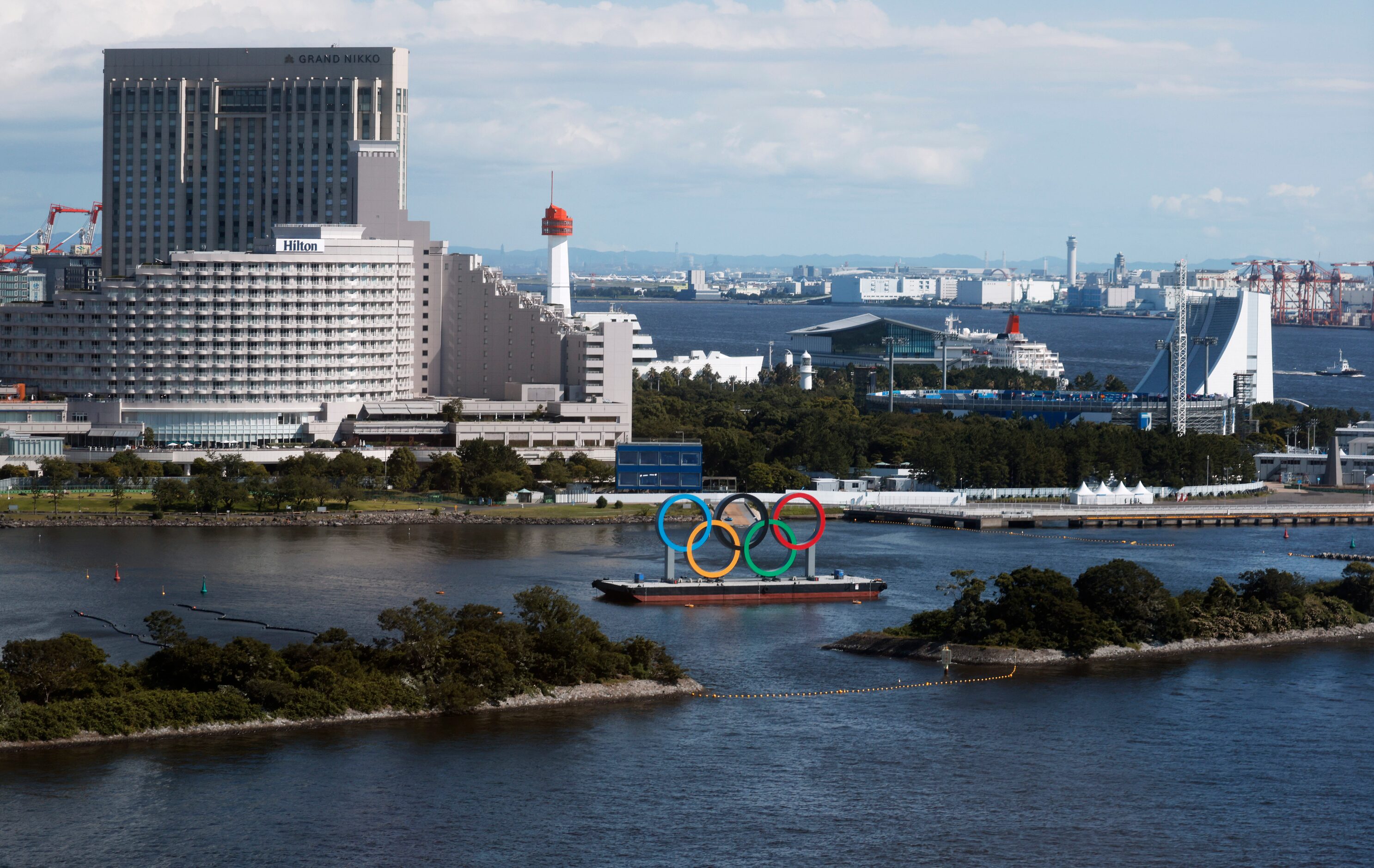 Olympic rings sit idle in the water during the postponed 2020 Tokyo Olympics on Friday, July...