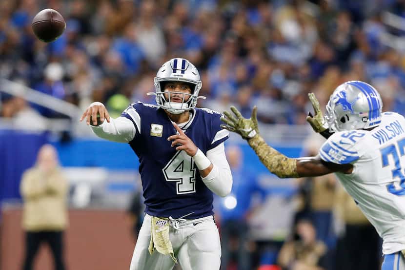 Dallas Cowboys quarterback Dak Prescott (4) attempts a pass as Detroit Lions strong safety...