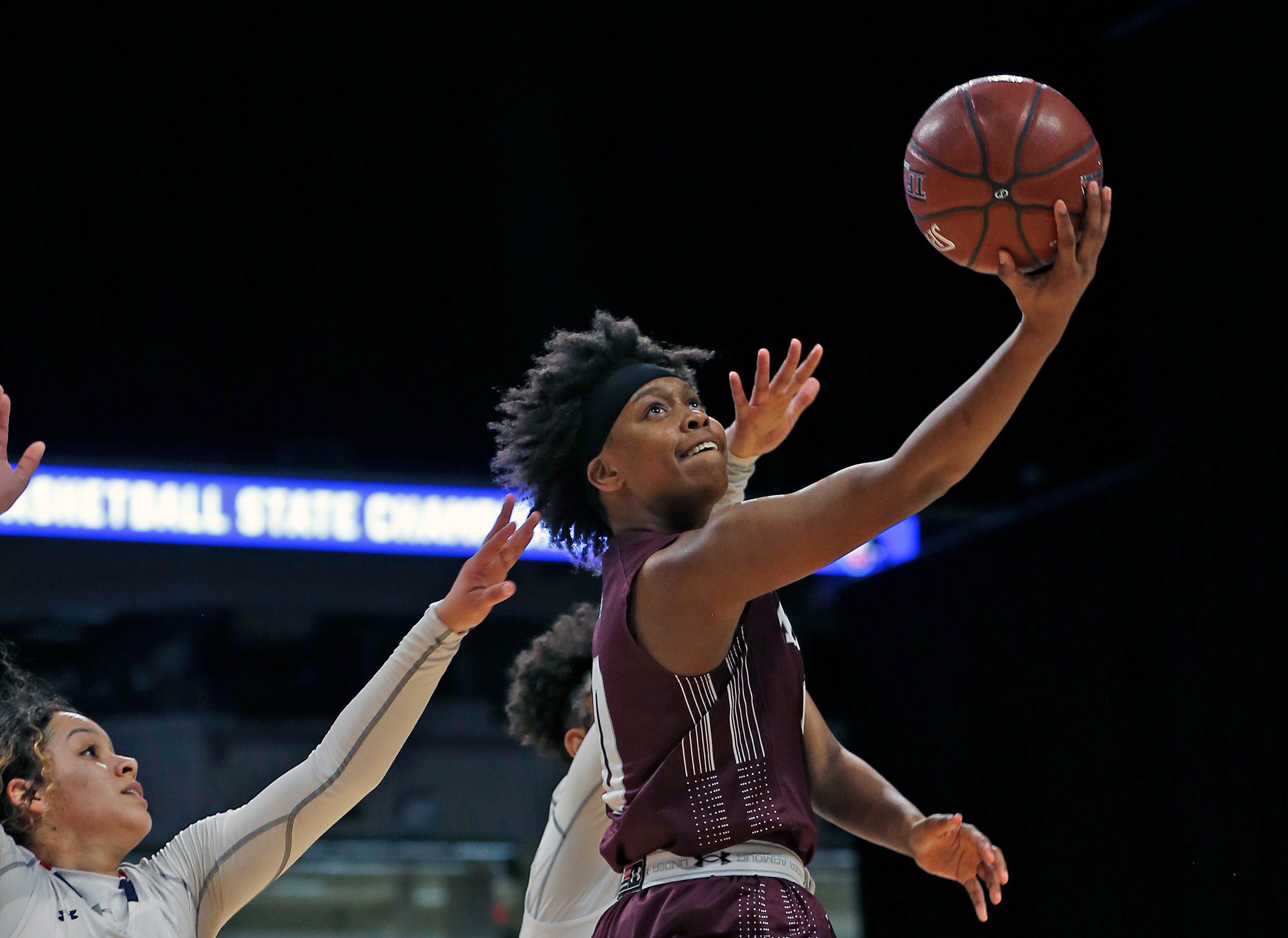 Mansfield Timberview guard Desiree Wooten #0 tries to score on a reverse lay-up in a 5A...