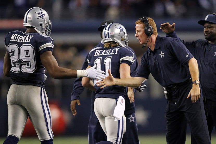 Dallas Cowboys head coach Jason Garrett congratulates running back DeMarco Murray (29) on...