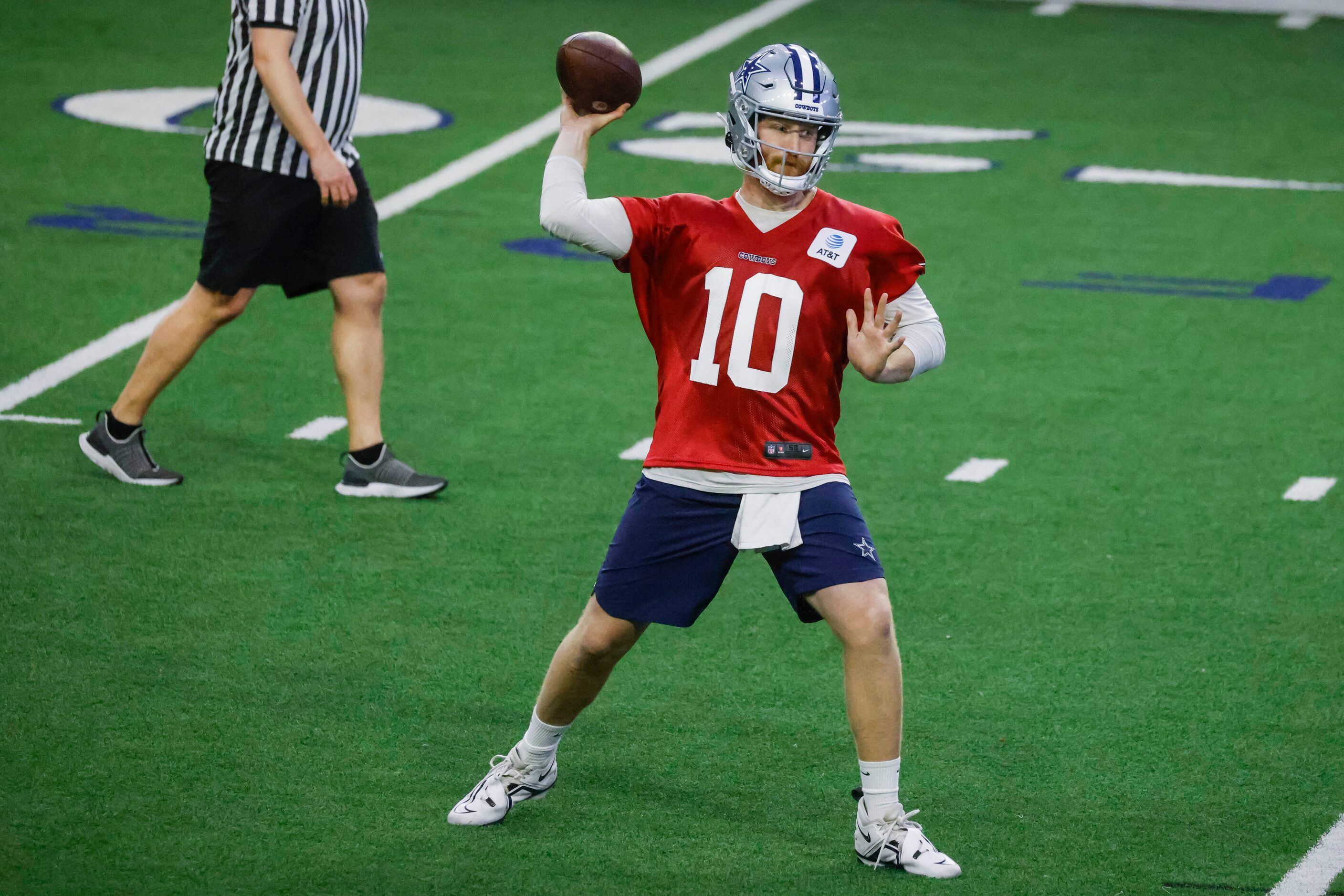 Dallas Cowboys quarterback Cooper Rush throws the ball during OTA practice on Thursday, May...