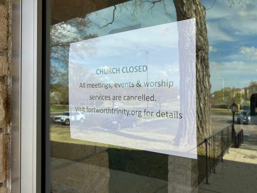 A sign at the Trinity Episcopal Church in Fort Worth, TX, shows the campus is closed as of...