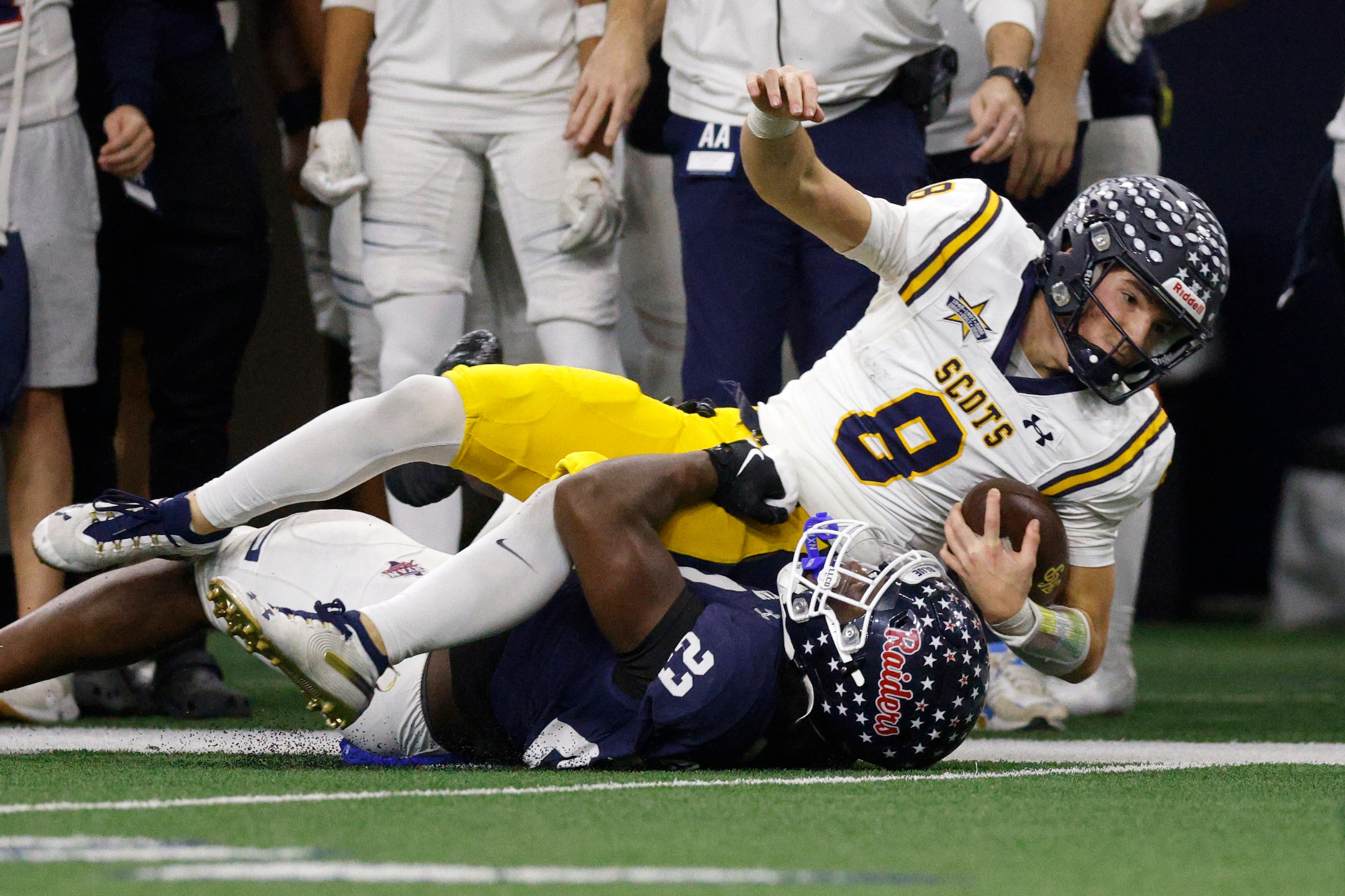 Denton Ryan linebacker Ashton Choice (23) tackles Highland Park quarterback Buck Randall (8)...