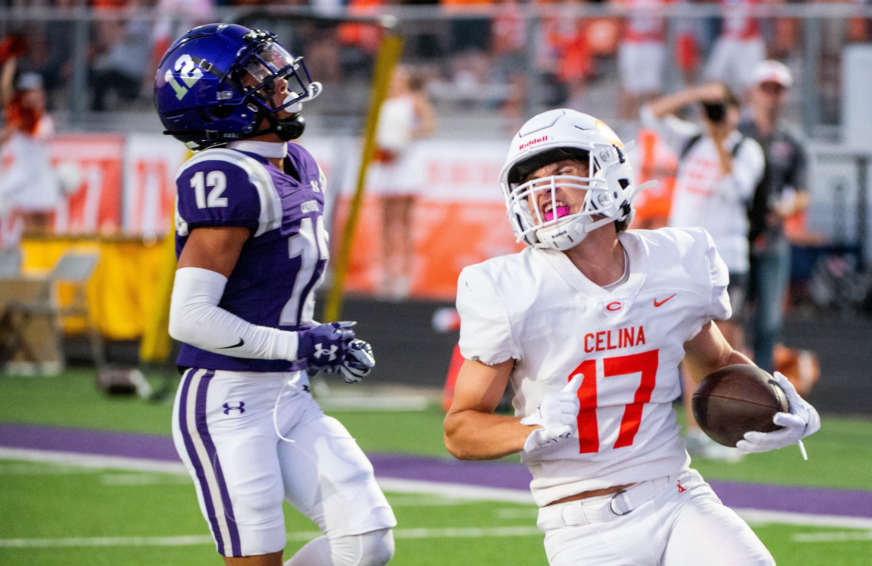 Celina Ryan Mikesch (17) celebrates a touchdown in front of Anna cornerback Elijah Robertson...