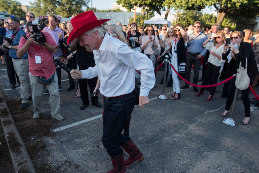 Richard Branson dances to country music after the ground breaking for his Virgin Hotel in...