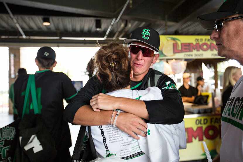 Southlake Carroll third baseman/first baseman senior Alec White (24) is hugged by his mom...