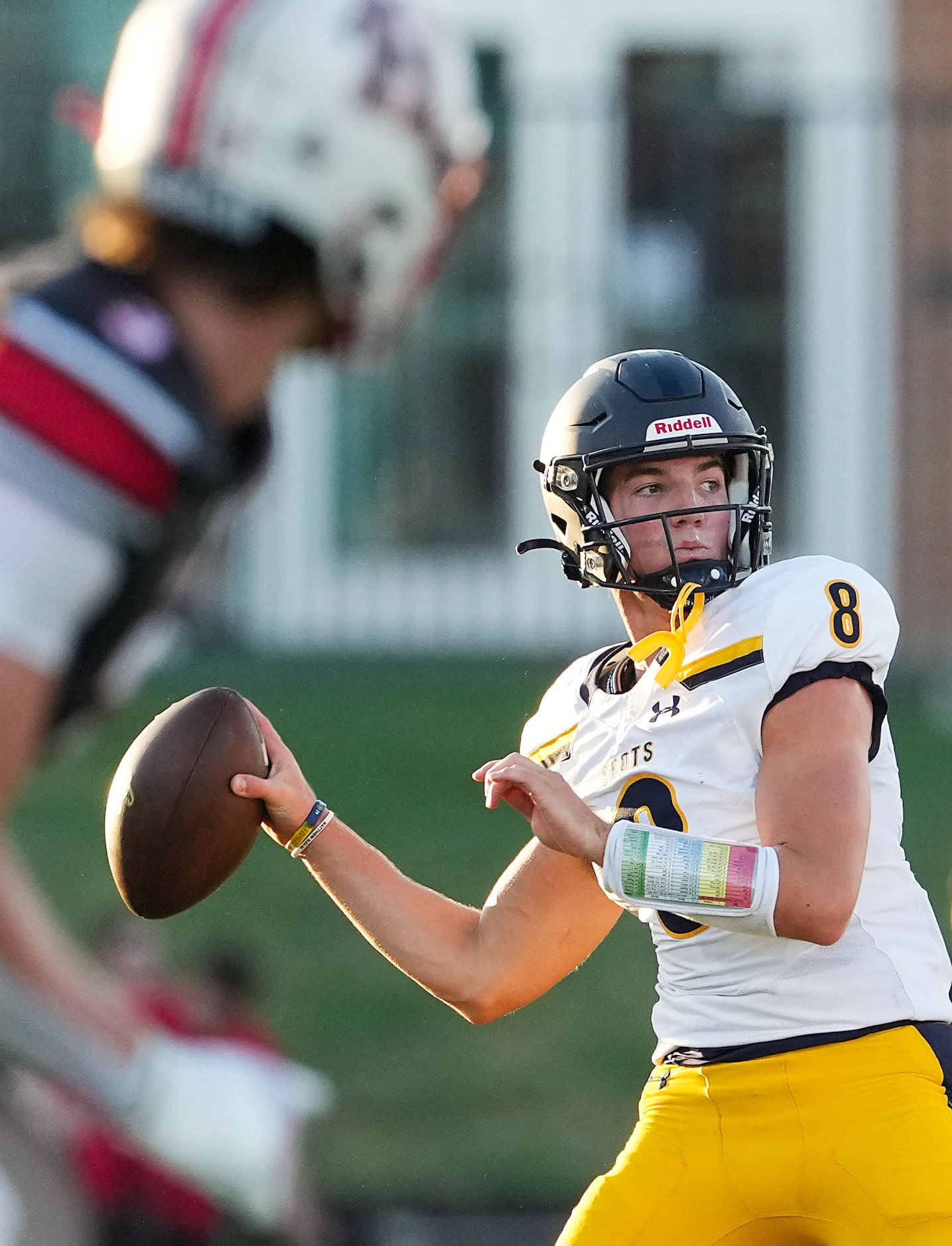 Highland Park quarterback Buck Randall (8) throws a pass during the first half of a high...