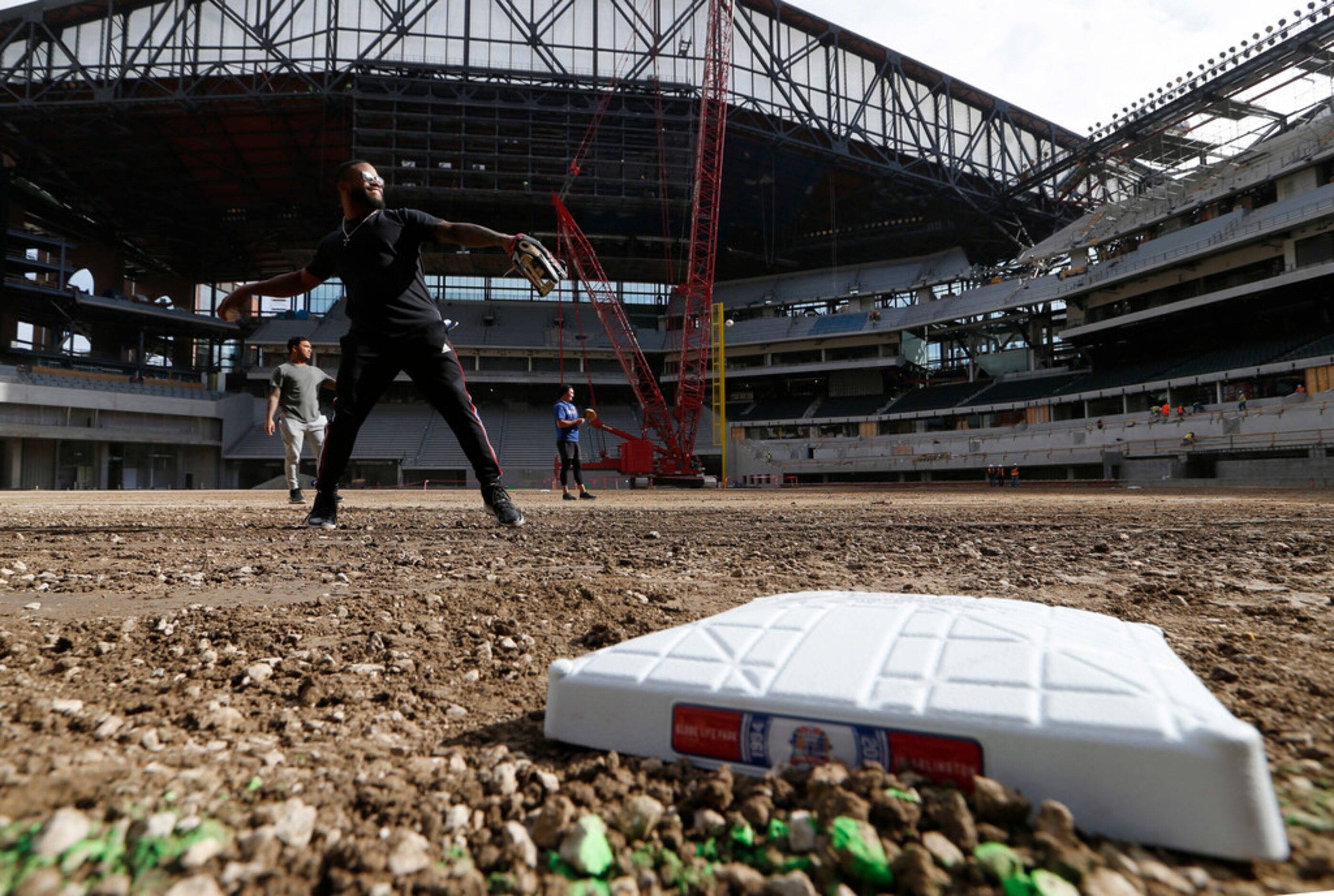 Texas Rangers Delino DeShields throws the baseball to a teammate at Globe Life Field in...